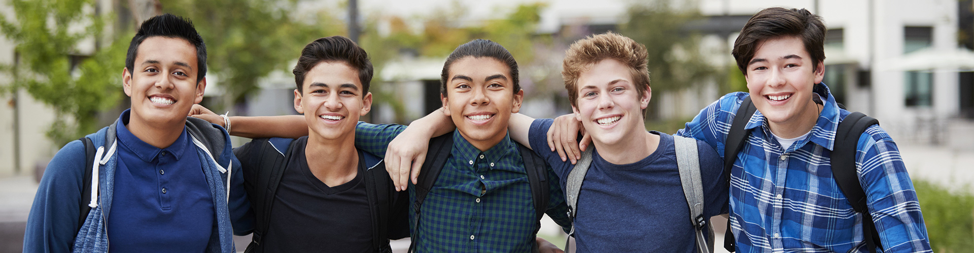 5 teen boys posing for group photo